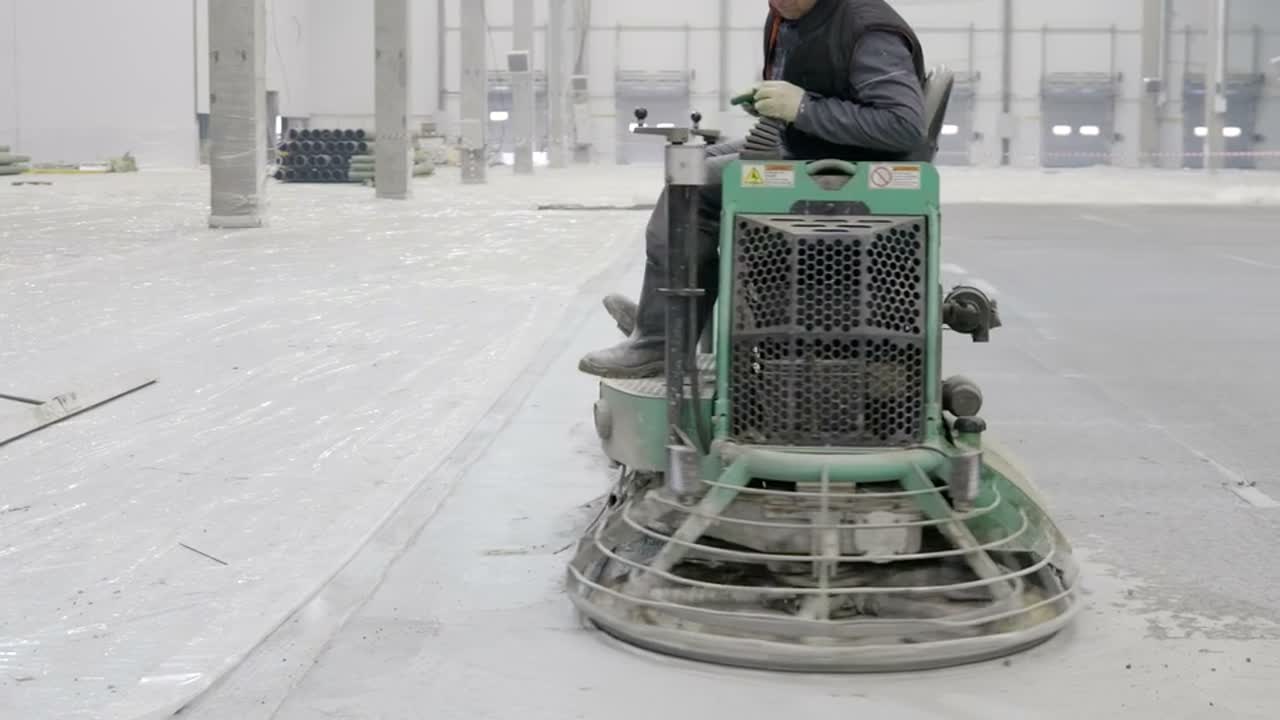 Power trowel finishing concrete